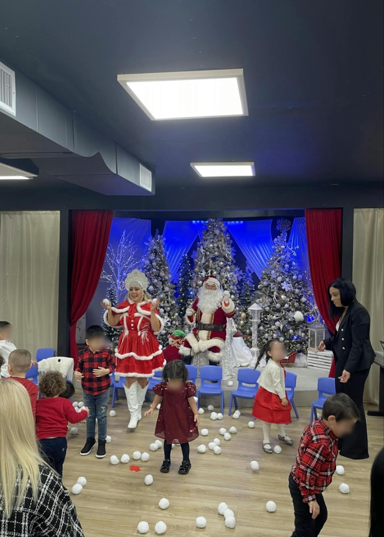 Children celebrating on stage with Santa at the Sunny Side Christmas performance