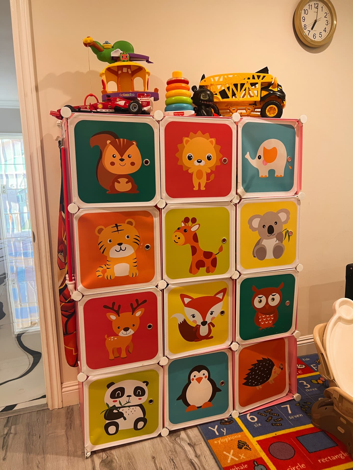 Colorful animal-themed toy storage cubes filled with toys
